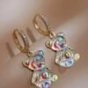 Boucles d'oreilles petit ours sur anneau serti de zircon