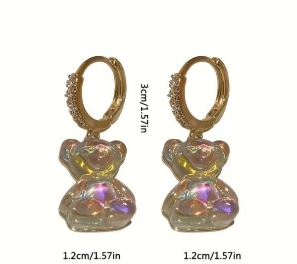 481143274_122138659232518320_7333831240863447658_n Boucles d'oreilles petit ours sur anneau serti de zircon