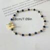Magnifique ensemble collier ras de cou perlé avec fermoir fleur et bracelet Perles de cristal