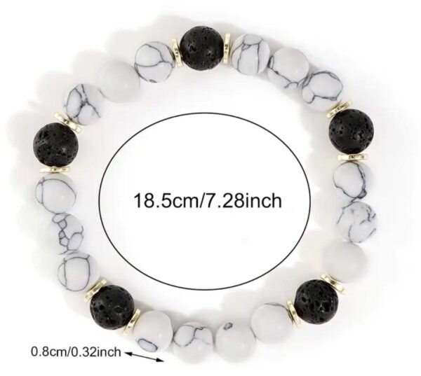 482328601_122140376696518320_8877473601464142298_n Bracelet en pierre de marbre et accents noirs avec perles d'espacement doré