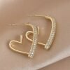 Boucles d'oreilles créoles à petits cœurs irrégulier incrusté de strass Plaqué or