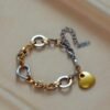 Bracelet  avec pendentif coeur bi couleur en acier inoxydable
