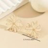 Boucles d'Oreilles Creuses en Forme de Fleur Dorée