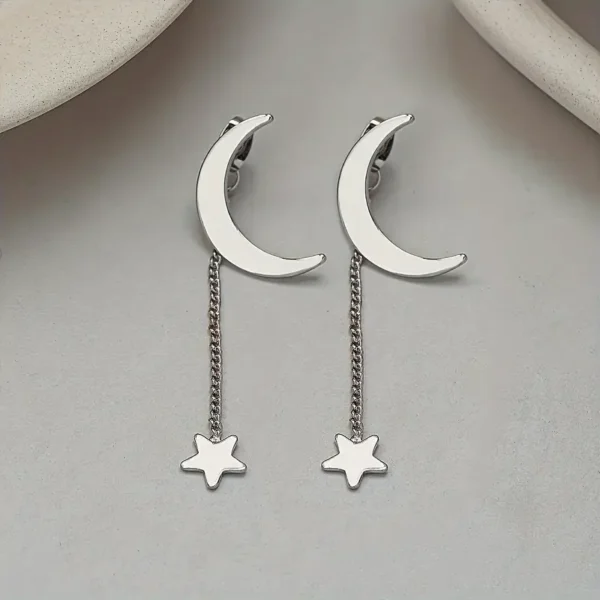 f0bb2a5e-460f-49c5-b647-de47dd9bb7c6 Boucles d'Oreilles Élégantes à Pompons Détachables Étoile & Lune