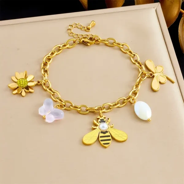 6801363d-af30-49ee-a5d6-09db281a9878 Bracelet en Acier Inoxydable Doré Abeille et Floral avec Design à Maillons
