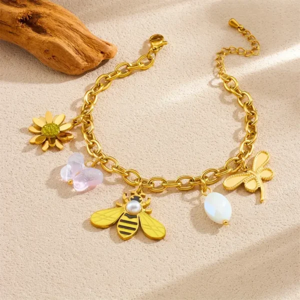 72bf120e-69dc-41fa-9bcd-af2691fc8037 Bracelet en Acier Inoxydable Doré Abeille et Floral avec Design à Maillons