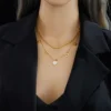 8e08ba39-3d2a-4e6b-a44c-f80315da0ac2 Collier Double Couche Minimaliste avec Pendentif Cœur Ajouré