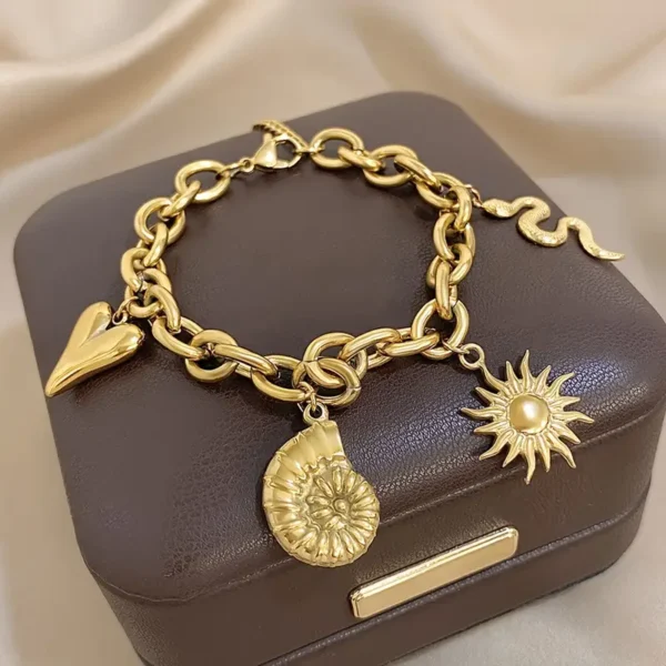9fd3bc6c-09c2-41bf-bded-bfc0c164af3c Bracelet avec pendentifs soleil et cœur en Acier inoxydable Doré