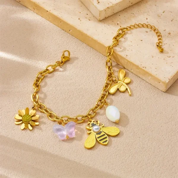 a64af73e-044c-4561-9d78-0936732aec05 Bracelet en Acier Inoxydable Doré Abeille et Floral avec Design à Maillons