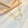 c2b7484f-3e4e-472a-a773-0804a2627342 Collier Double Couche Minimaliste avec Pendentif Cœur Ajouré