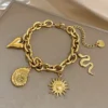 Bracelet avec pendentifs soleil et cœur en Acier inoxydable Doré