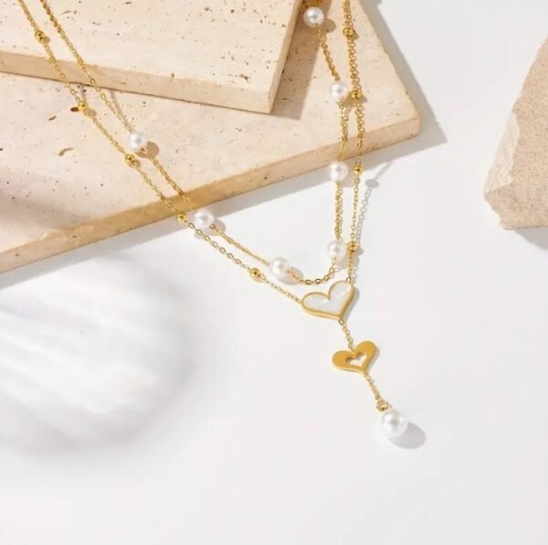 Capture d’écran 2025-09-07 190748 Collier Double Couche Pendentif en forme de cœur avec perle blanche