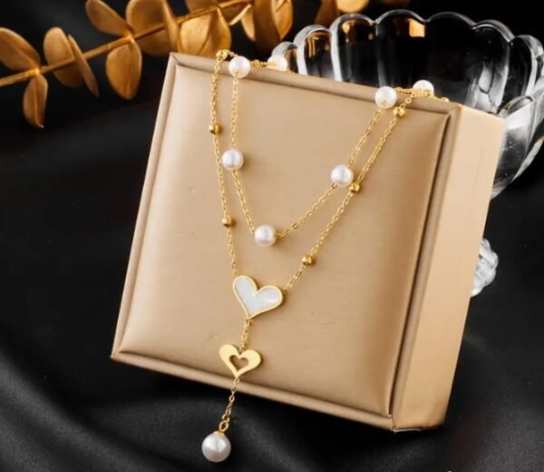 Capture d’écran 2025-09-07 190825 Collier Double Couche Pendentif en forme de cœur avec perle blanche