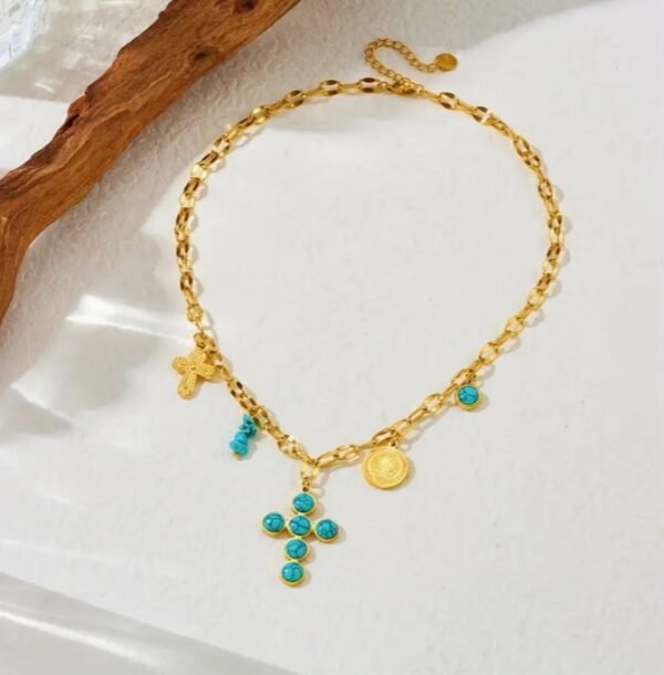 Capture d’écran 2025-09-17 111502 Collier gothique doré avec croix turquoise