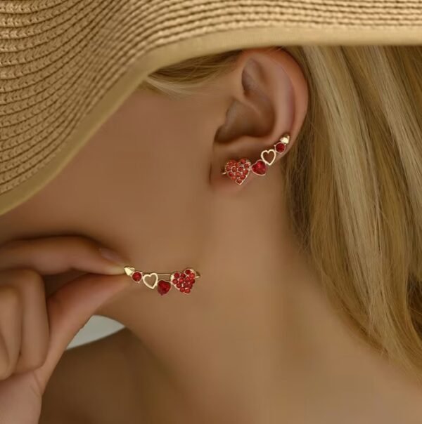Capture d’écran 2025-12-01 160901 Boucles d'oreilles pendantes à arc osseux inspirantes avec clous en forme de cœur rouge
