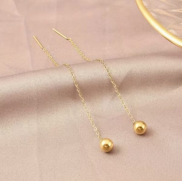 Boucles d'oreilles à pompons dorés en acier inoxydable