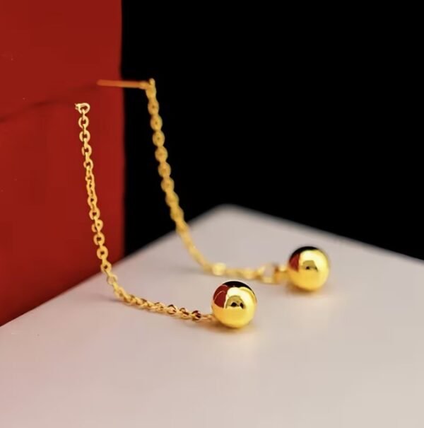 Boucles d'oreilles à pompons dorés en acier inoxydable